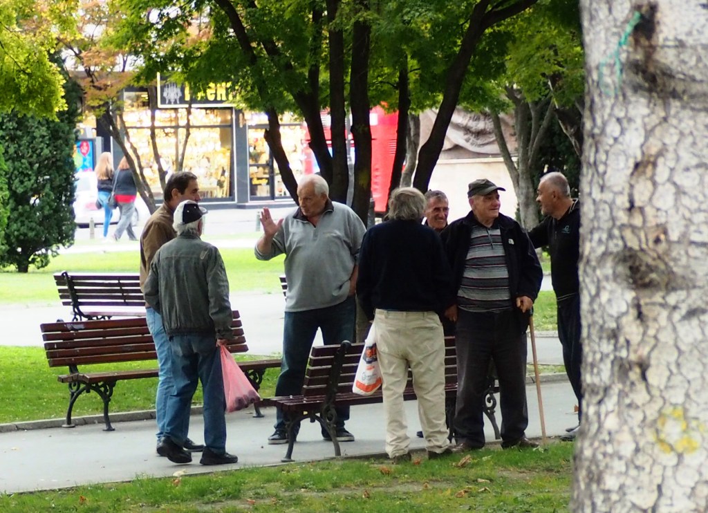 Old men gathered in park in Skopje, Macedonia